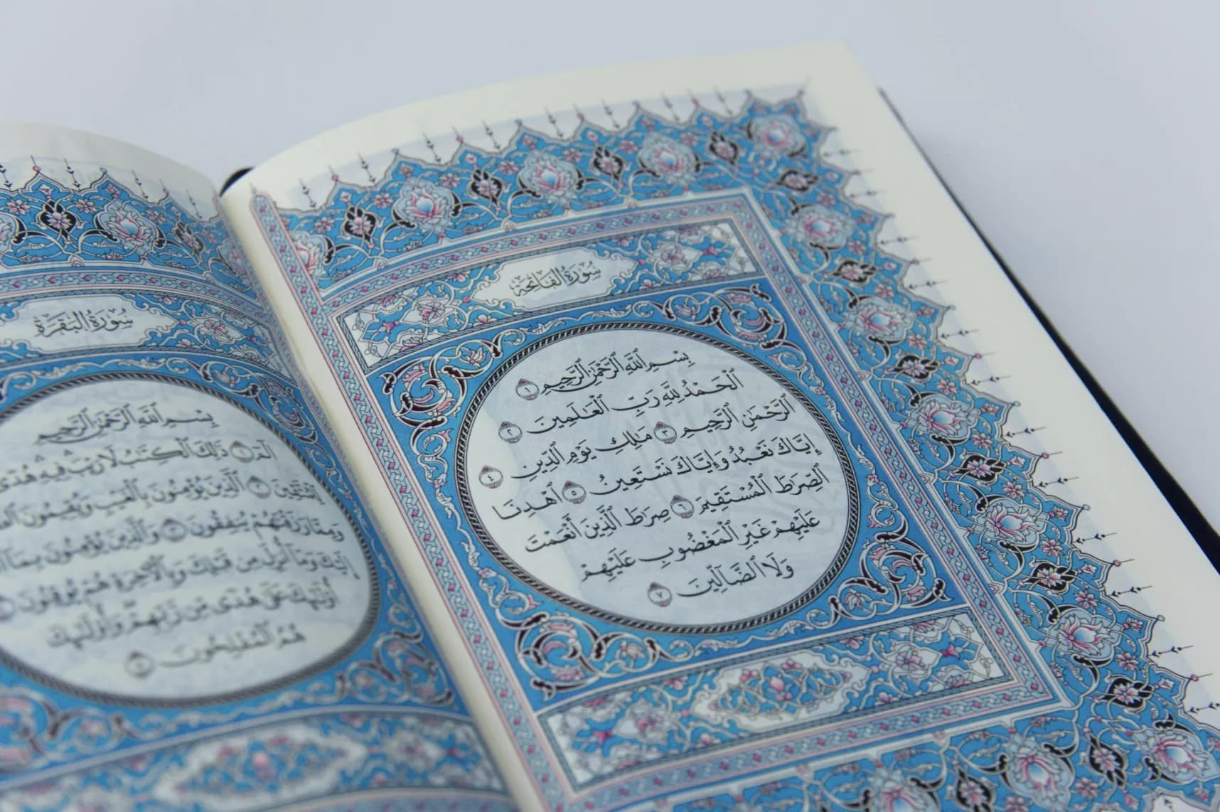 An open Qur’an showing Surah Al-Fatiha in Arabic